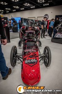 Race cars, performance parts, new products, and motorsports technology on display at PRI Show 2025 in Indianapolis, Indiana.