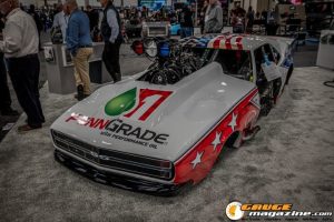 Race cars, performance parts, new products, and motorsports technology on display at PRI Show 2025 in Indianapolis, Indiana.
