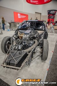 Race cars, performance parts, new products, and motorsports technology on display at PRI Show 2025 in Indianapolis, Indiana.