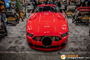 Race cars, performance parts, new products, and motorsports technology on display at PRI Show 2025 in Indianapolis, Indiana.