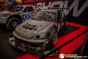 Race cars, performance parts, new products, and motorsports technology on display at PRI Show 2025 in Indianapolis, Indiana.