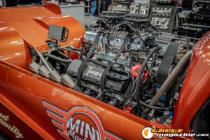 Race cars, performance parts, new products, and motorsports technology on display at PRI Show 2025 in Indianapolis, Indiana.
