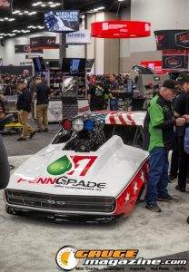 Race cars, performance parts, new products, and motorsports technology on display at PRI Show 2025 in Indianapolis, Indiana.