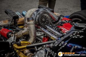 Race cars, performance parts, new products, and motorsports technology on display at PRI Show 2025 in Indianapolis, Indiana.