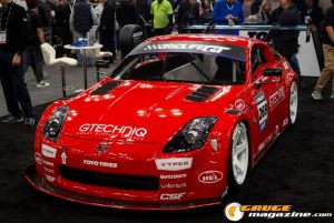 Race cars, performance parts, new products, and motorsports technology on display at PRI Show 2025 in Indianapolis, Indiana.