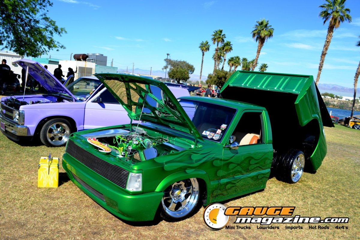 Green Mazda custom pickup with tilt bed and detailed engine bay at Forbidden Fantasy Show n Shine 2026