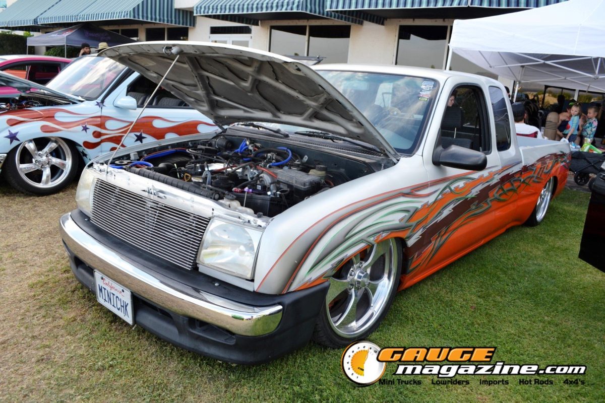 forbidden-fantasy-show-n-shine-2026-106-white-orange-toyota-pickup-graphic-paint-engine-bay
