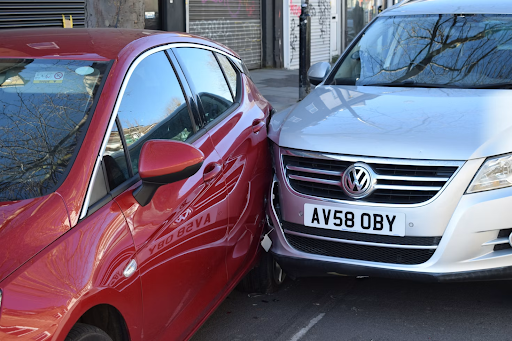 Two damaged vehicles illustrating the difference between vehicle damage and personal injury
