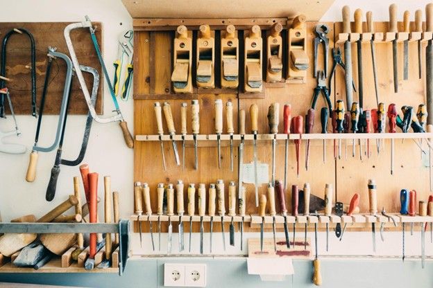 Clean home garage workspace with organized tools and equipment