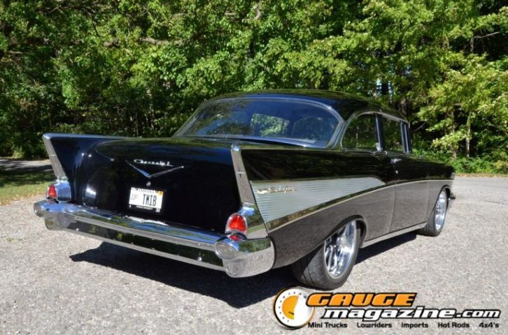 Black and silver 1957 Chevrolet 210 custom viewed from the rear three-quarter angle