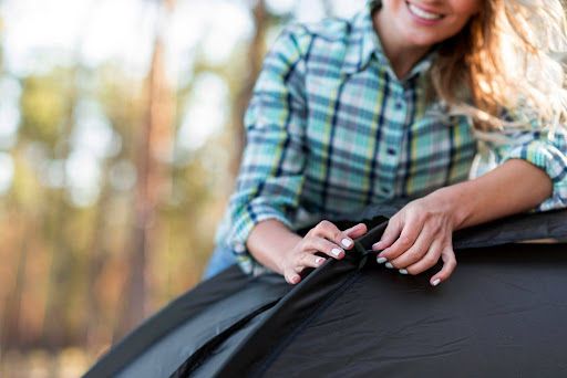Waterproof car cover protecting a vehicle stored outdoors