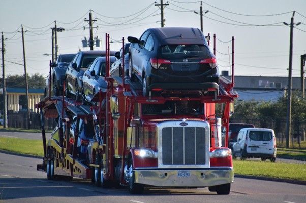 Auto transporter supporting long-distance car buying