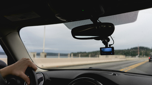 In-car video camera recording driving footage through a windshield