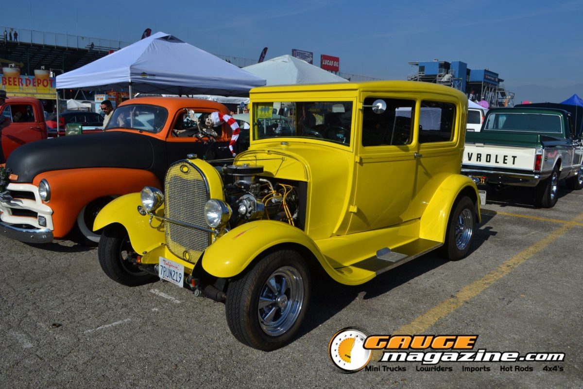mooneyes-christmas-party-2025-266-yellow-ford-model-a-sedan-hot-rod