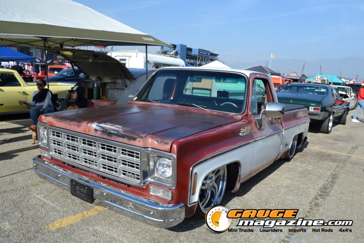 mooneyes-christmas-party-2025-254-red-white-chevrolet-c10-lowered-pickup