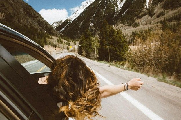 Car packed with weekend road trip essentials for a scenic drive