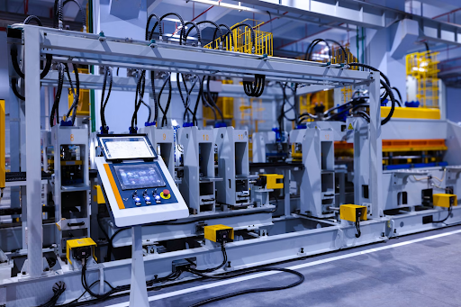 Automated machinery operating inside a smart manufacturing facility